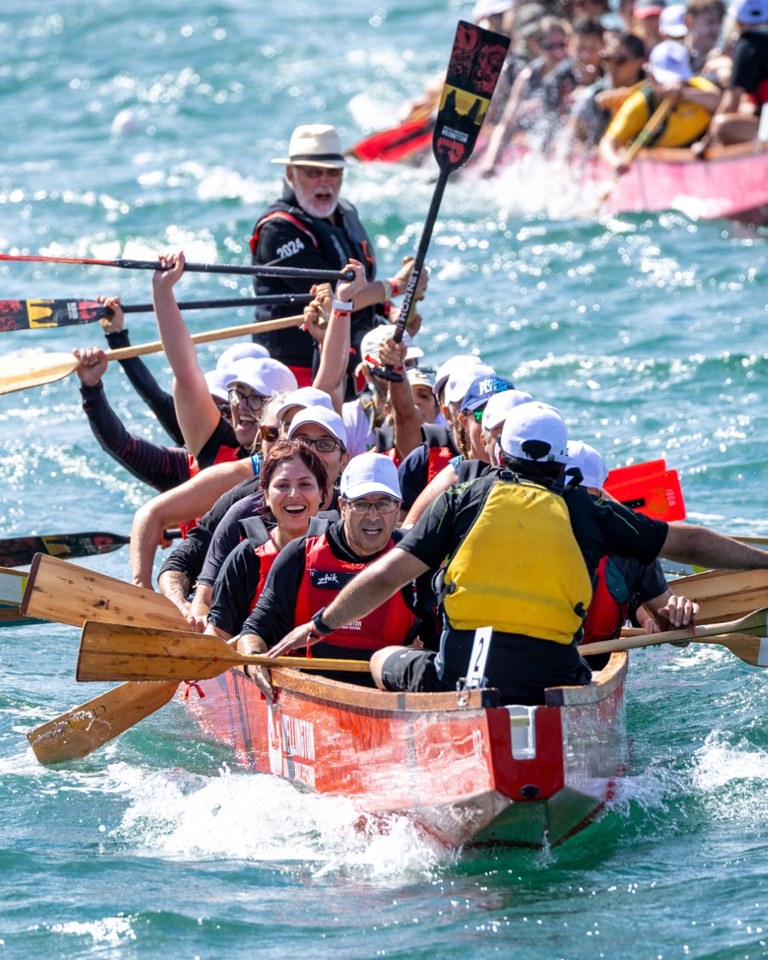 Dragon boat crew celebrating on Wellington Harbour